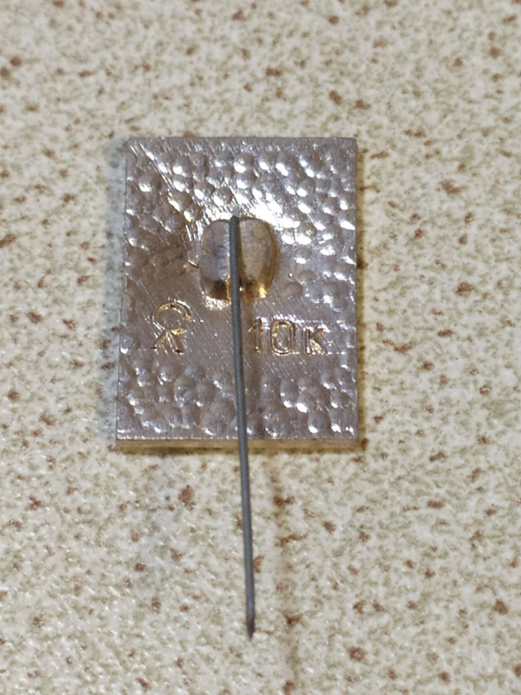 Reverse of Cold War era Soviet 50 years pin