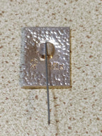 Reverse of Cold War era Soviet 50 years pin