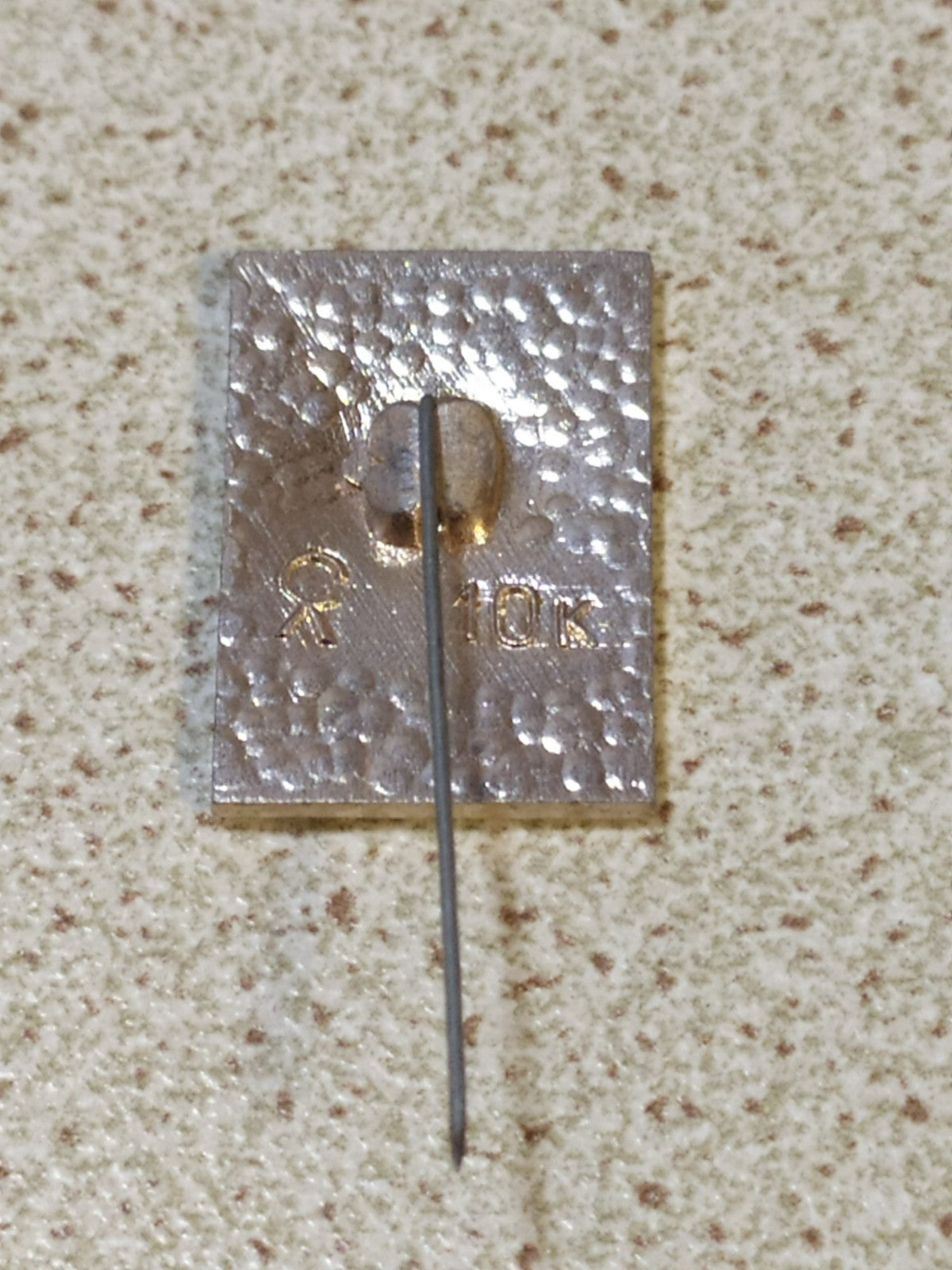 Reverse of Cold War era Soviet 50 years pin
