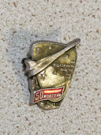 Soviet aviation badge with slogan We Conquer Space and Time