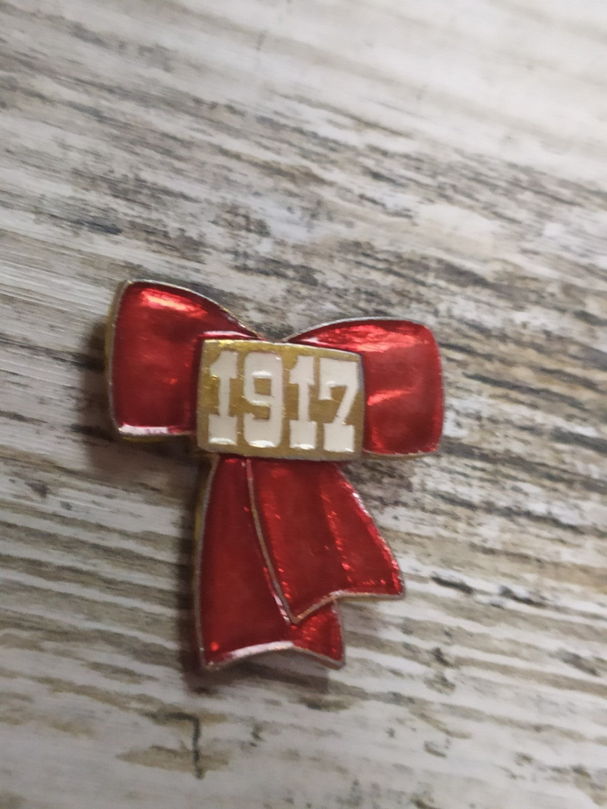USSR badge with ribbon design marking the 1917 October Revolution in red enamel