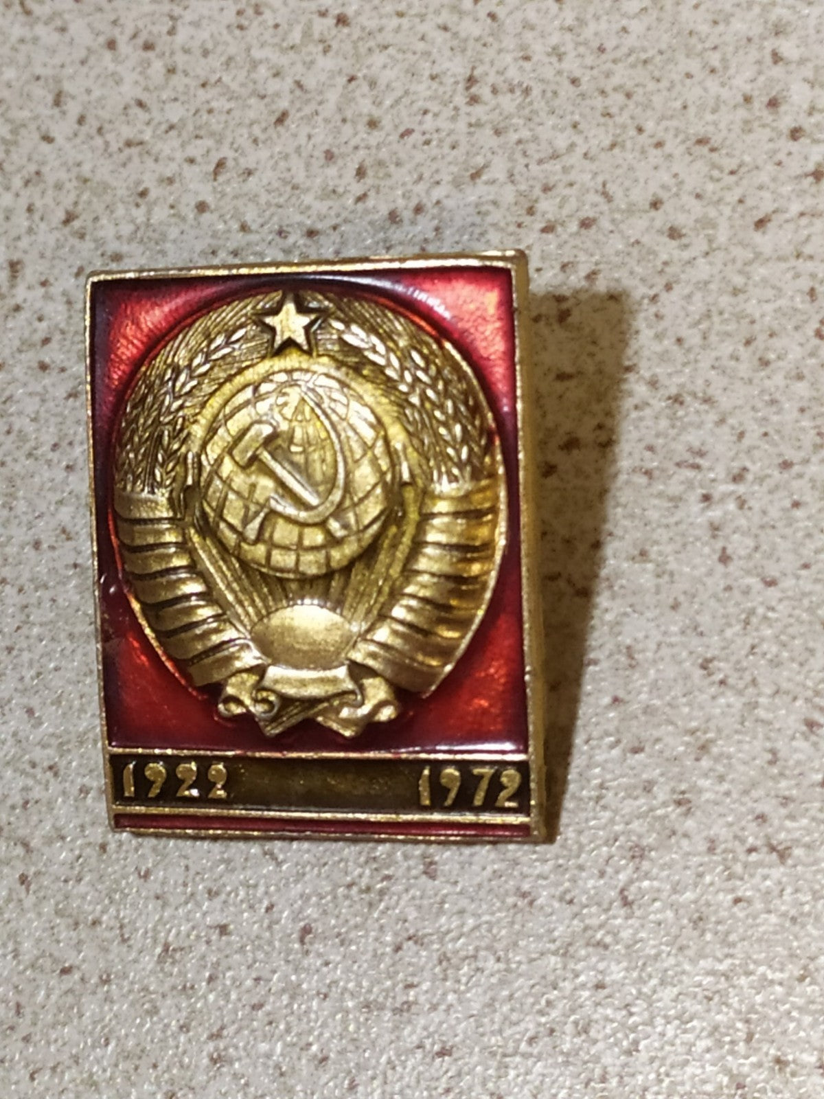 Cold War era USSR badge with commemorative dates