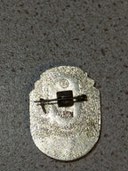 Old Soviet anniversary pin badge shown for scale