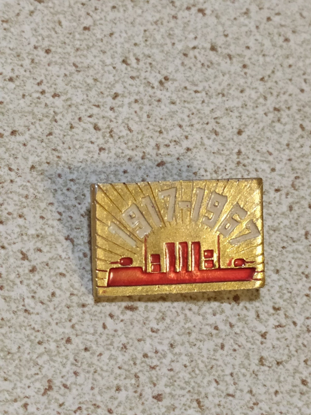 Soviet jubilee badge showing the Aurora cruiser