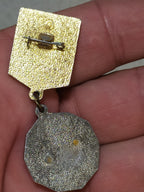 Reverse of the 1st class Komsomol badge with fitting