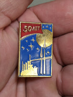 Vintage USSR space exploration pin on plain background