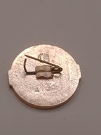 Soviet Sportloto fencing pin, silver and red, front view