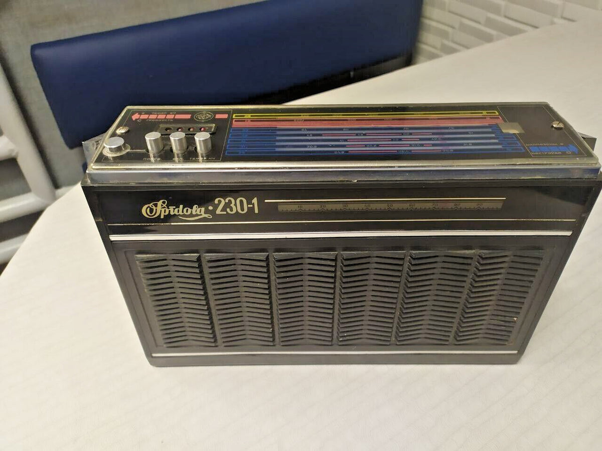 VEF Spidola 230-1 Soviet radio with black plastic case and chevron speaker grilles