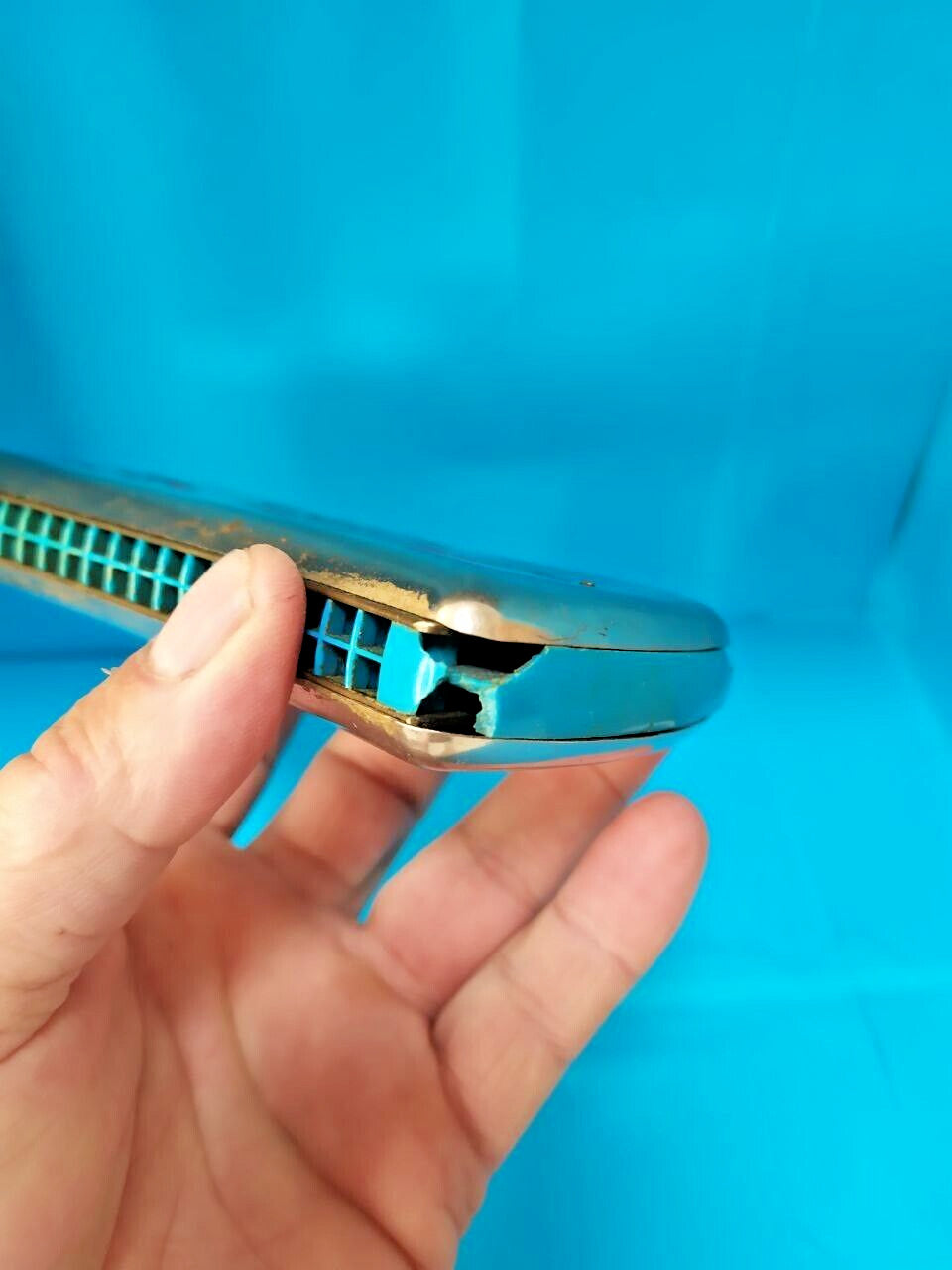 GDR Vermona harmonica with red and black logo and geometric cutouts on chrome covers – detail 11