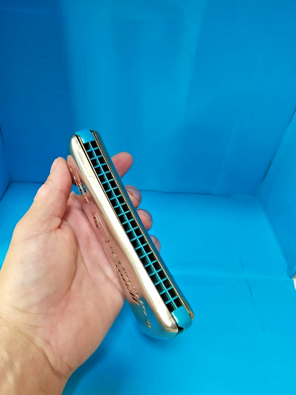 GDR Vermona harmonica with red and black logo and geometric cutouts on chrome covers – detail 14