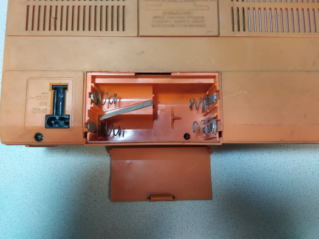 Orange and brown Soviet tape recorder with carrying handle and Cyrillic labels – detail 11