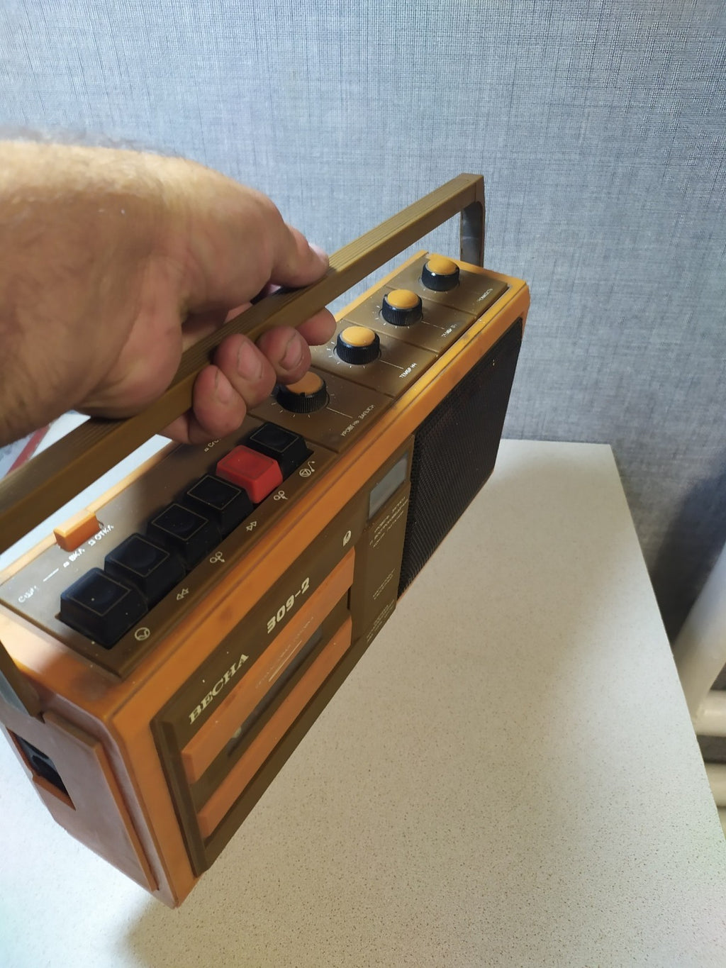 Orange and brown Soviet tape recorder with carrying handle and Cyrillic labels – detail 8