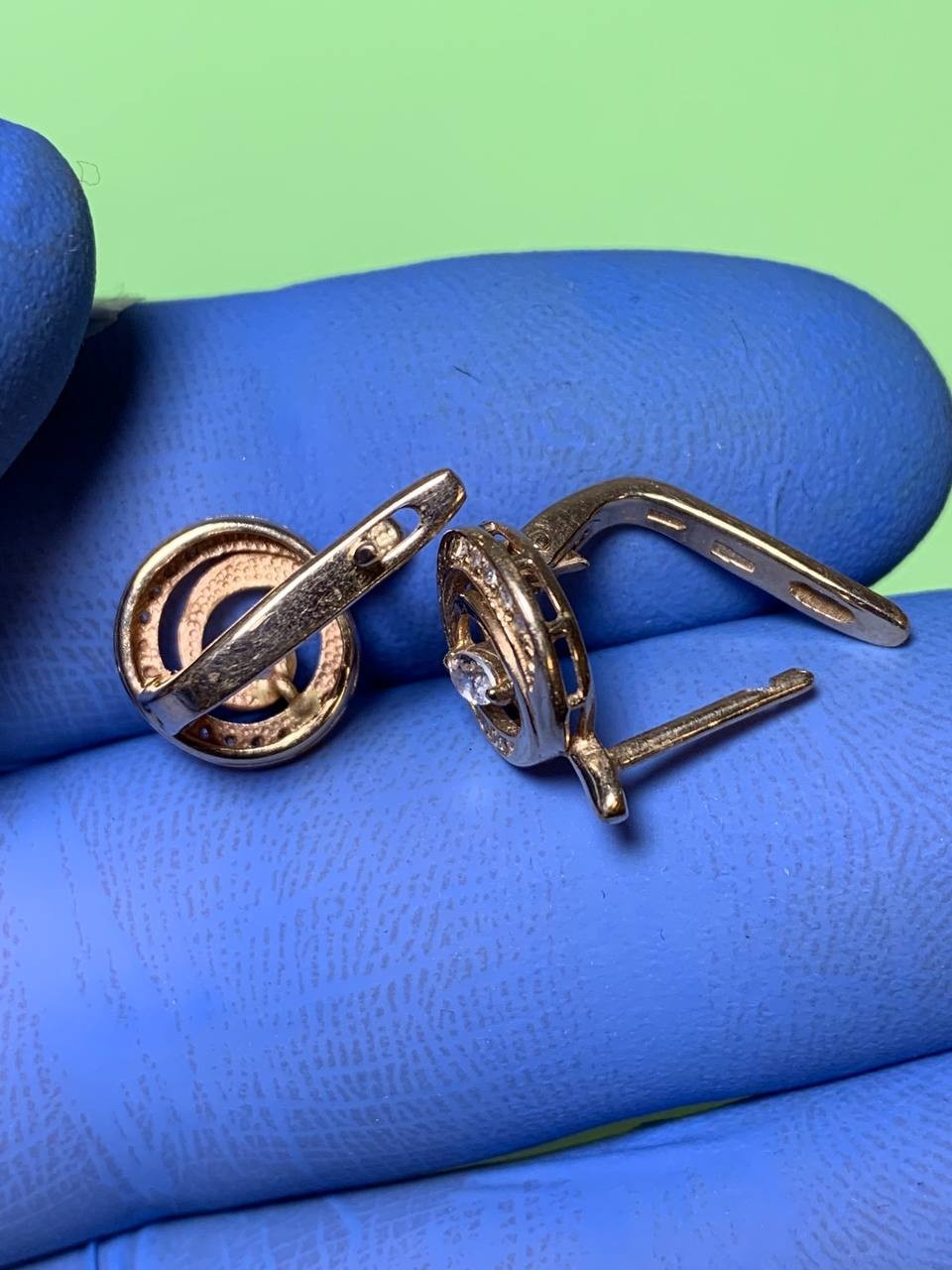583 gold earrings close-up showing the classic design