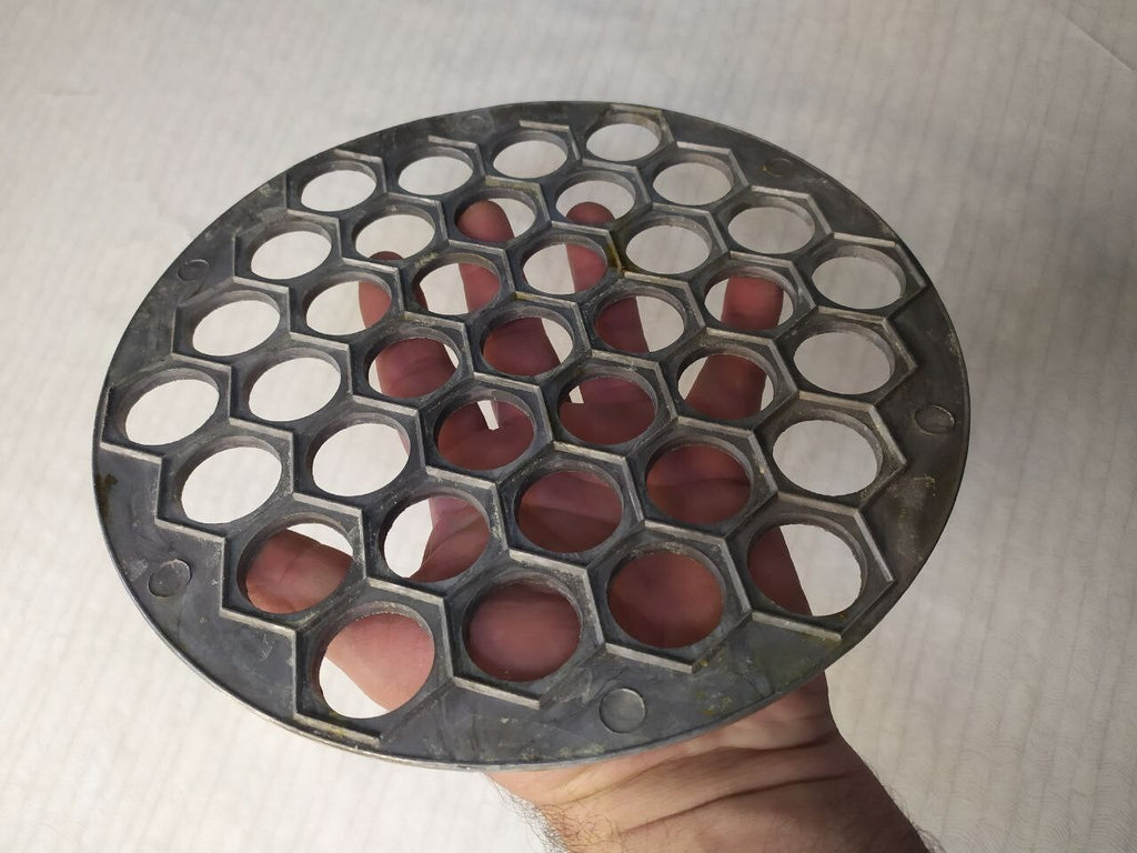 Russian dumpling mold with pockets, close-up view