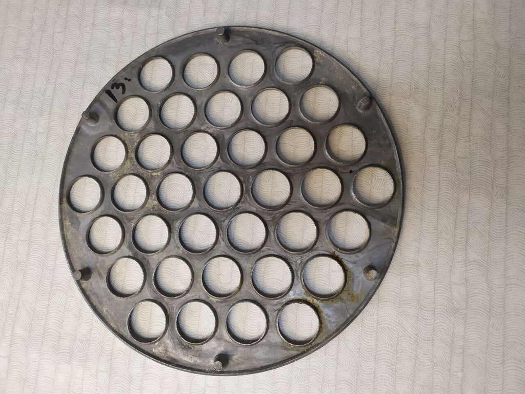 Used vintage dumpling maker showing traces of time on the metal