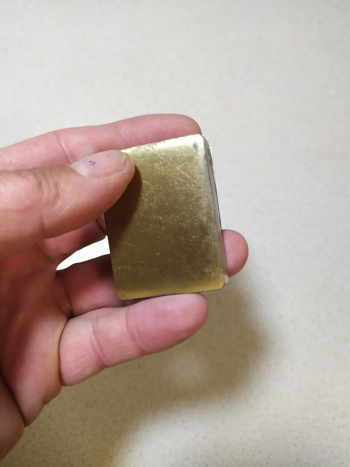 Brass torch lighter with raised trident on the front plate