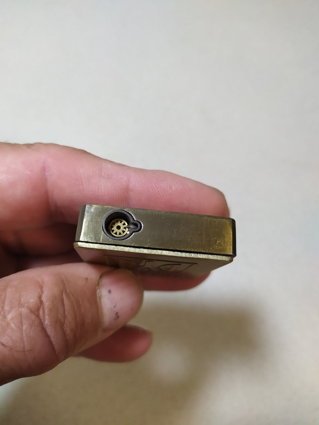 Brass torch lighter with raised trident on the front plate – detail 5