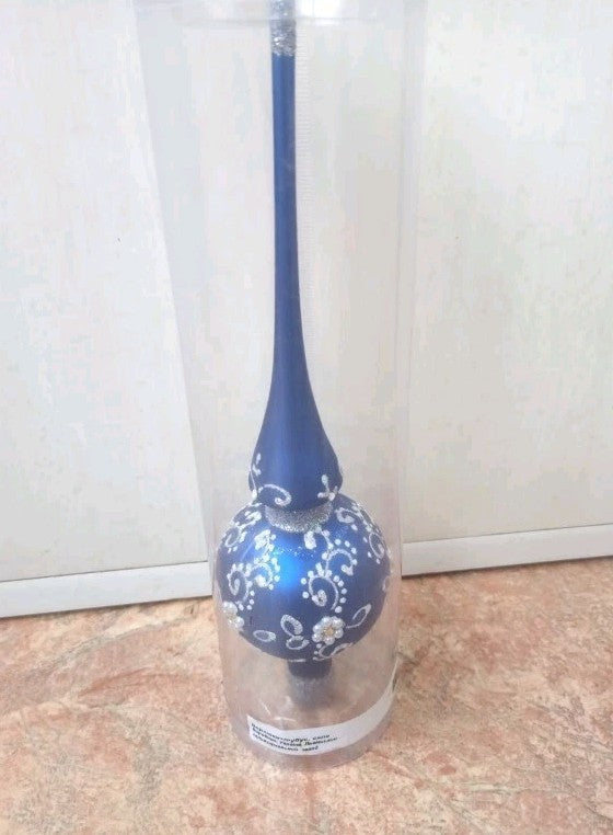 Old Christmas tree topper shown from the front