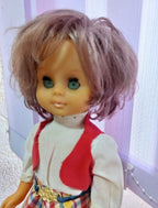 Doll in folk costume, plaid skirt with gold-tone buckle detail