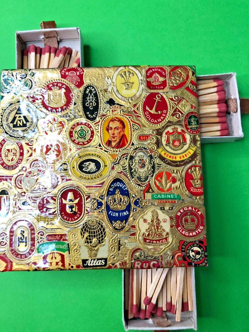 Tobacciana match holder with four sliding drawers