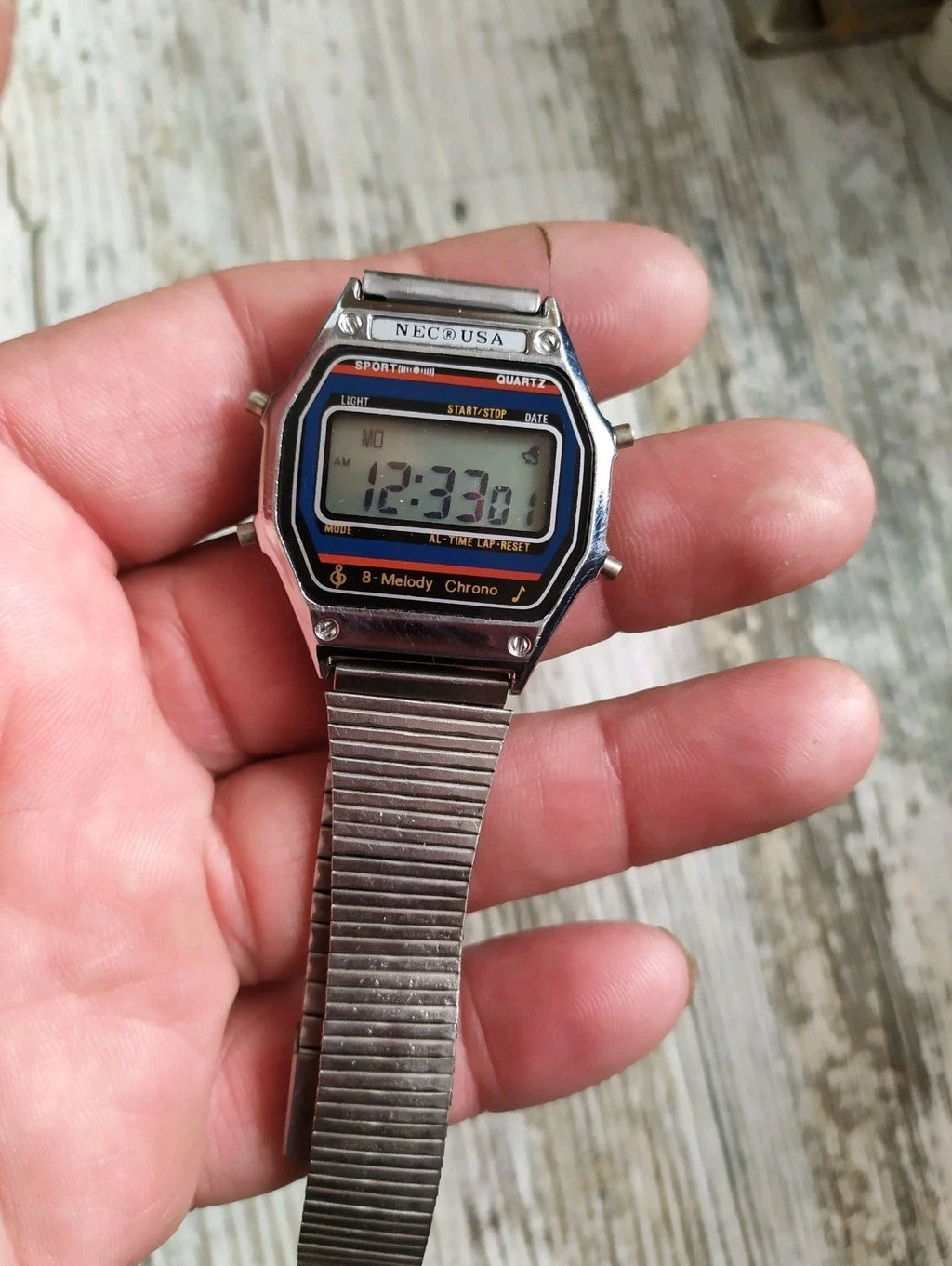 Vintage 1980s digital watch with stainless steel expandable bracelet