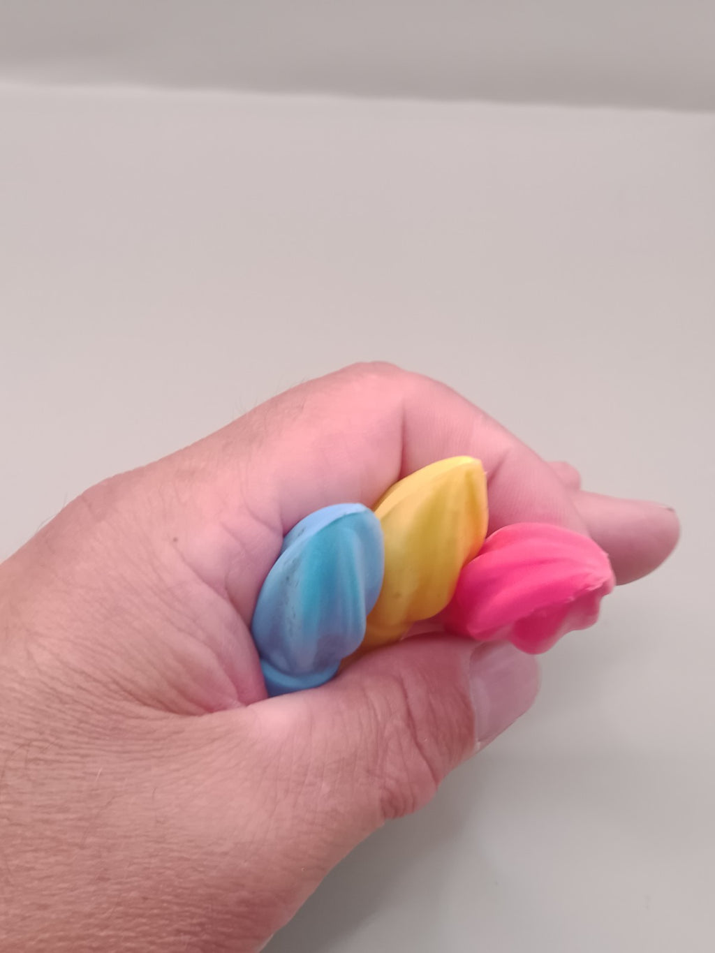 Three vintage plastic cap covers laid side by side