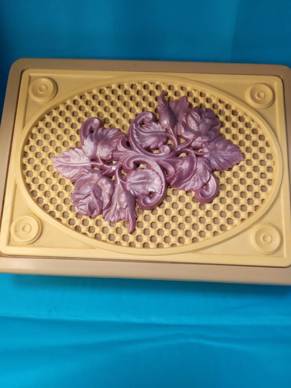 Vintage plastic jewelry box with embossed purple rose on cream lattice lid