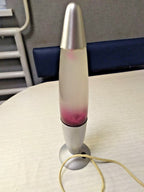 Pink and purple wax flowing in a vintage rocket lamp