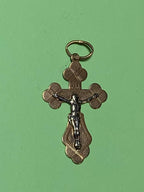 14K gold crucifix pendant with Jesus Christ figure, close-up