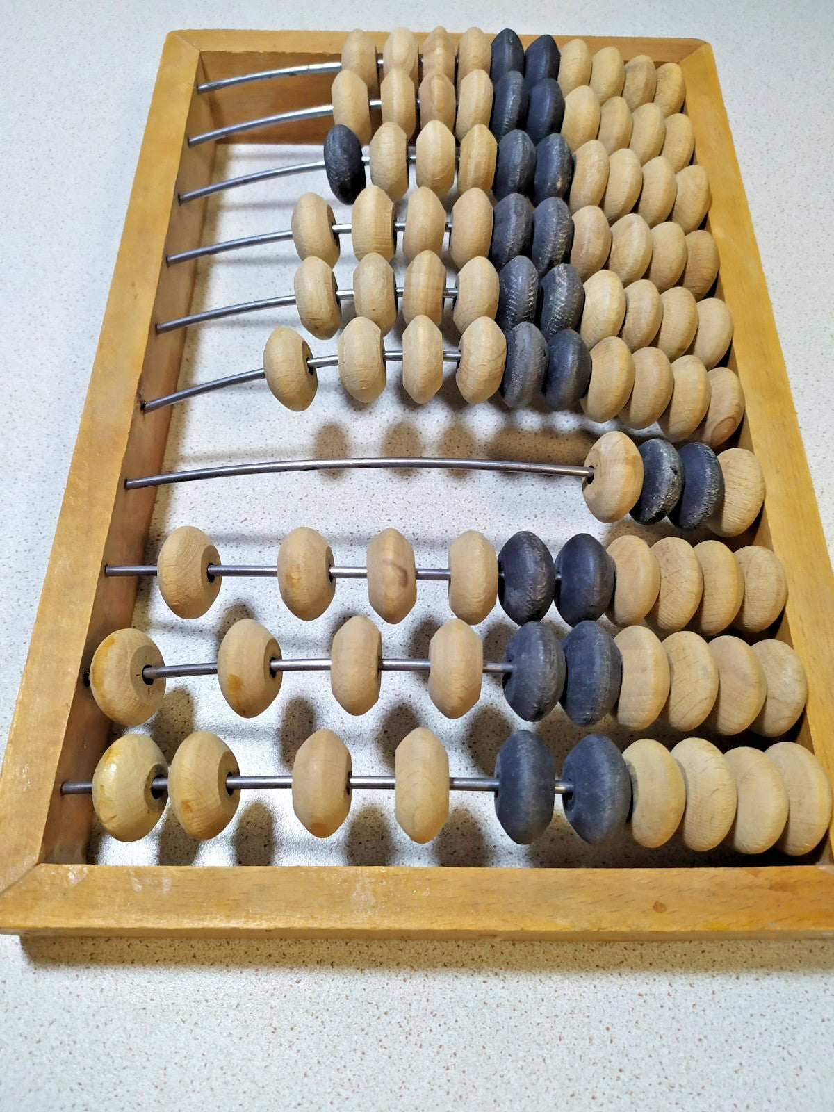 Small Soviet-era abacus next to a tape measure, approx. 30 x 18 cm