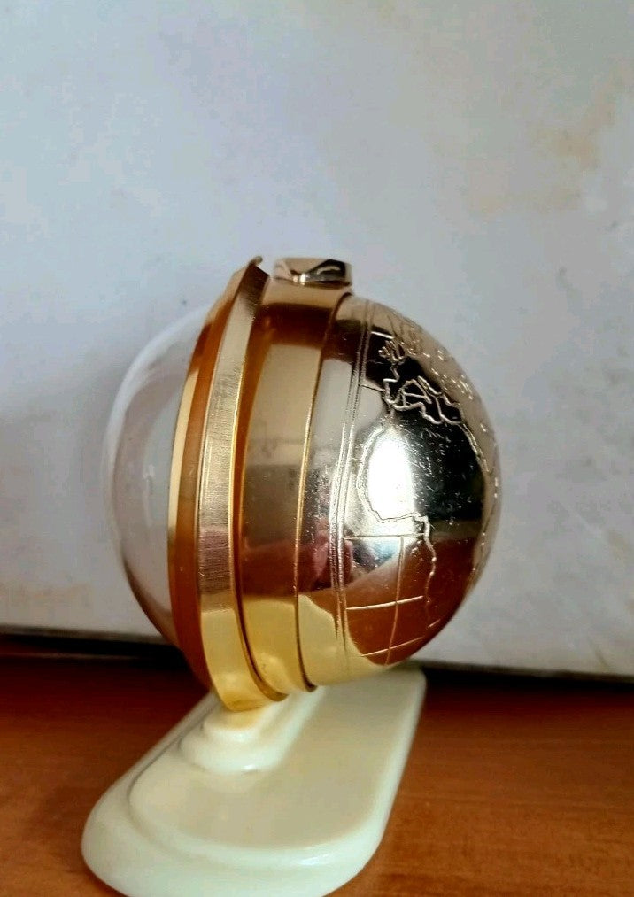 Slava globe clock case engraved with a world map and USSR marking