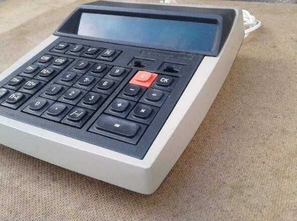 VFD calculator display showing all 12 digits lit in bright green