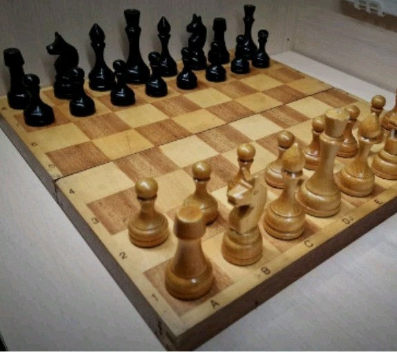 Classic Soviet knight and king chess pieces in light and dark wood – detail 6