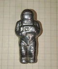 Vintage Soviet cosmonaut figurine in a high-pressure spacesuit, cast metal