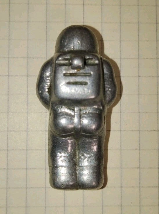 Soviet space collectibles: metal cosmonaut miniature with life support backpack