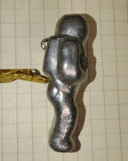 Natural patina on a Soviet space memorabilia metal figurine