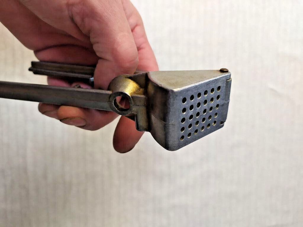 Used vintage garlic crusher made in the Soviet Union, detail