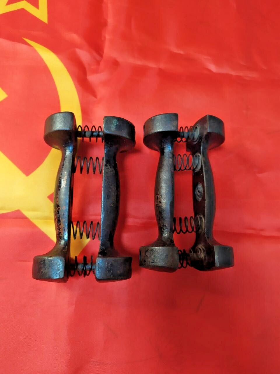 Pair of vintage Soviet hand grippers in heavy cast iron with steel springs