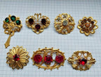 Ruby red faceted crystal brooches in gold-tone settings – detail 5