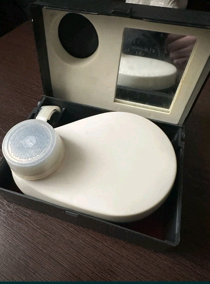Vintage Soviet mechanical shaver Sputnik-2 with its black case and mirror