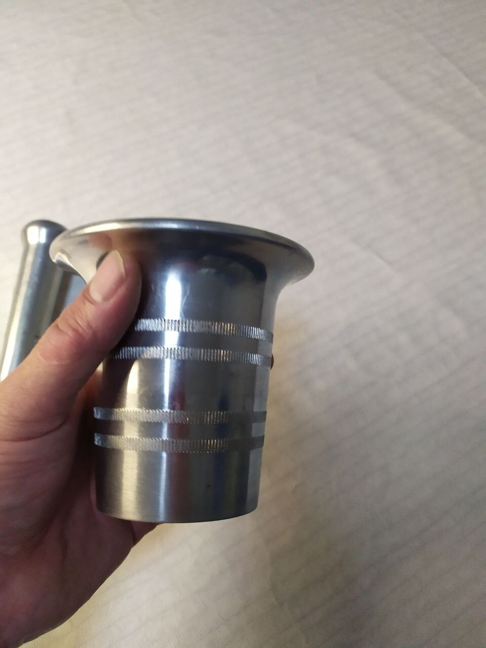 Vintage mortar and pestle on a scale showing 917 grams