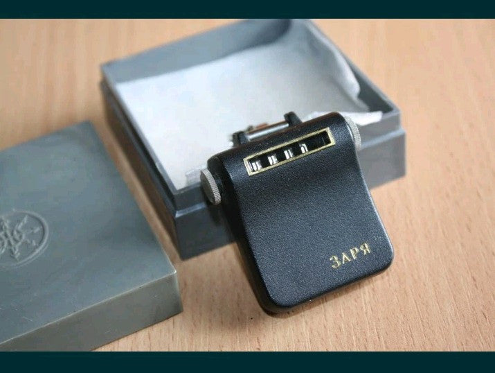 Vintage Soviet pedometer Zarya in a black case with gold lettering