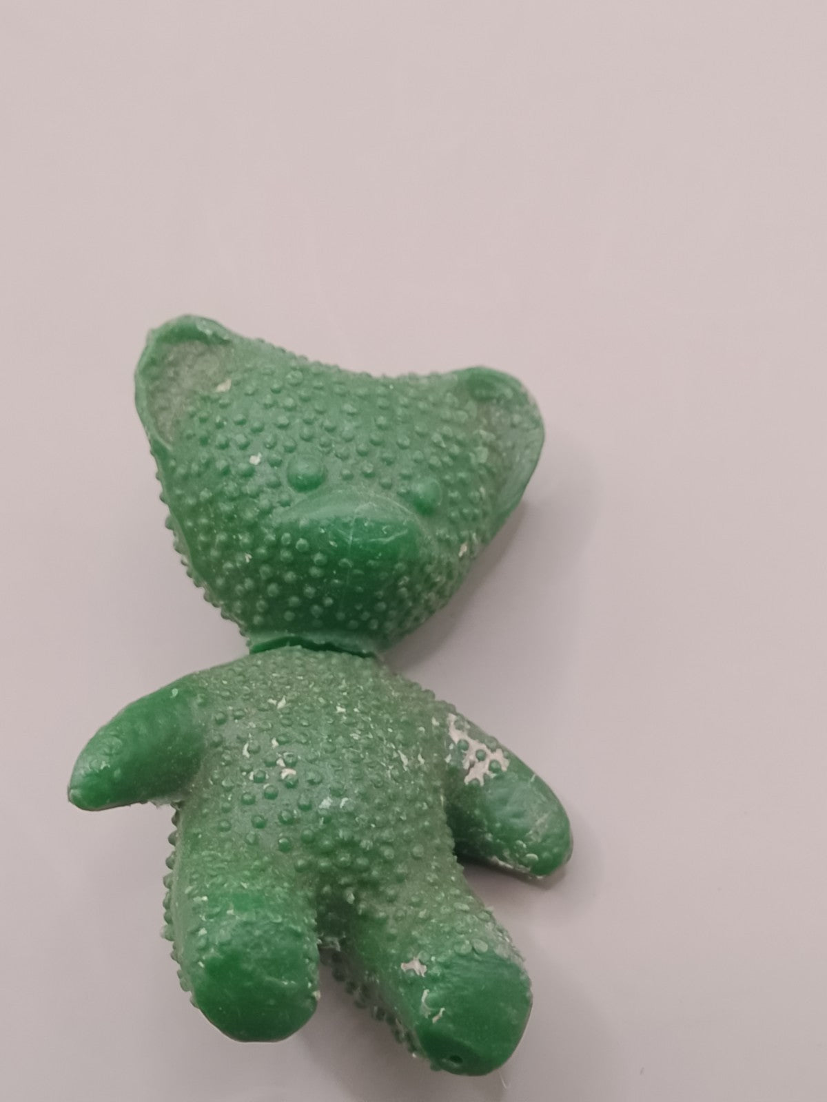 Old Soviet toys: green bear figure side view