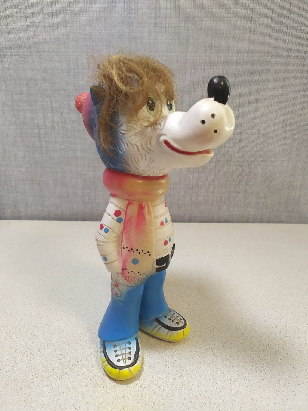 Vintage Soviet rubber toy of the Nu Pogodi Wolf in winter outfit with ice skates