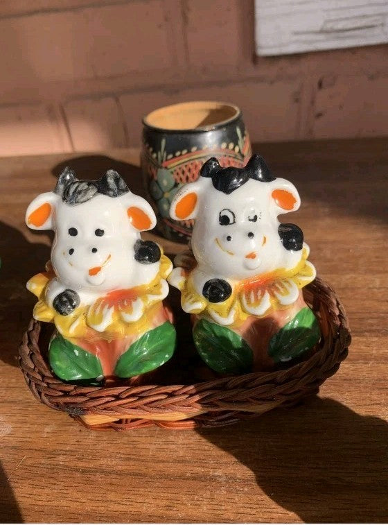 Soviet porcelain dancing cows salt and pepper shakers in a wicker basket