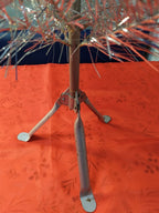 Retro Space Age silver Christmas tree decorated with ornaments