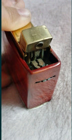 Soviet desk lighter with glossy swirled red and yellow body