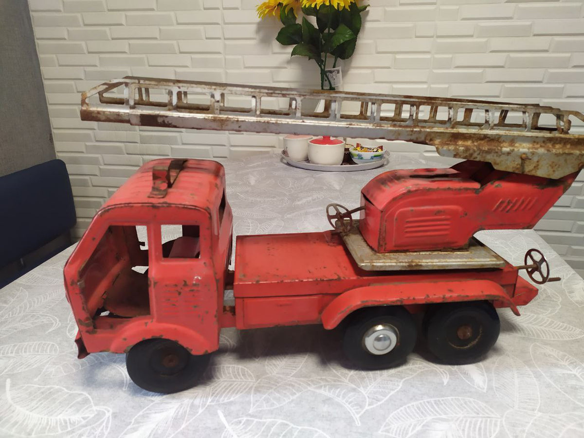 Vintage Soviet toy fire truck by SIM in red pressed steel with ladder
