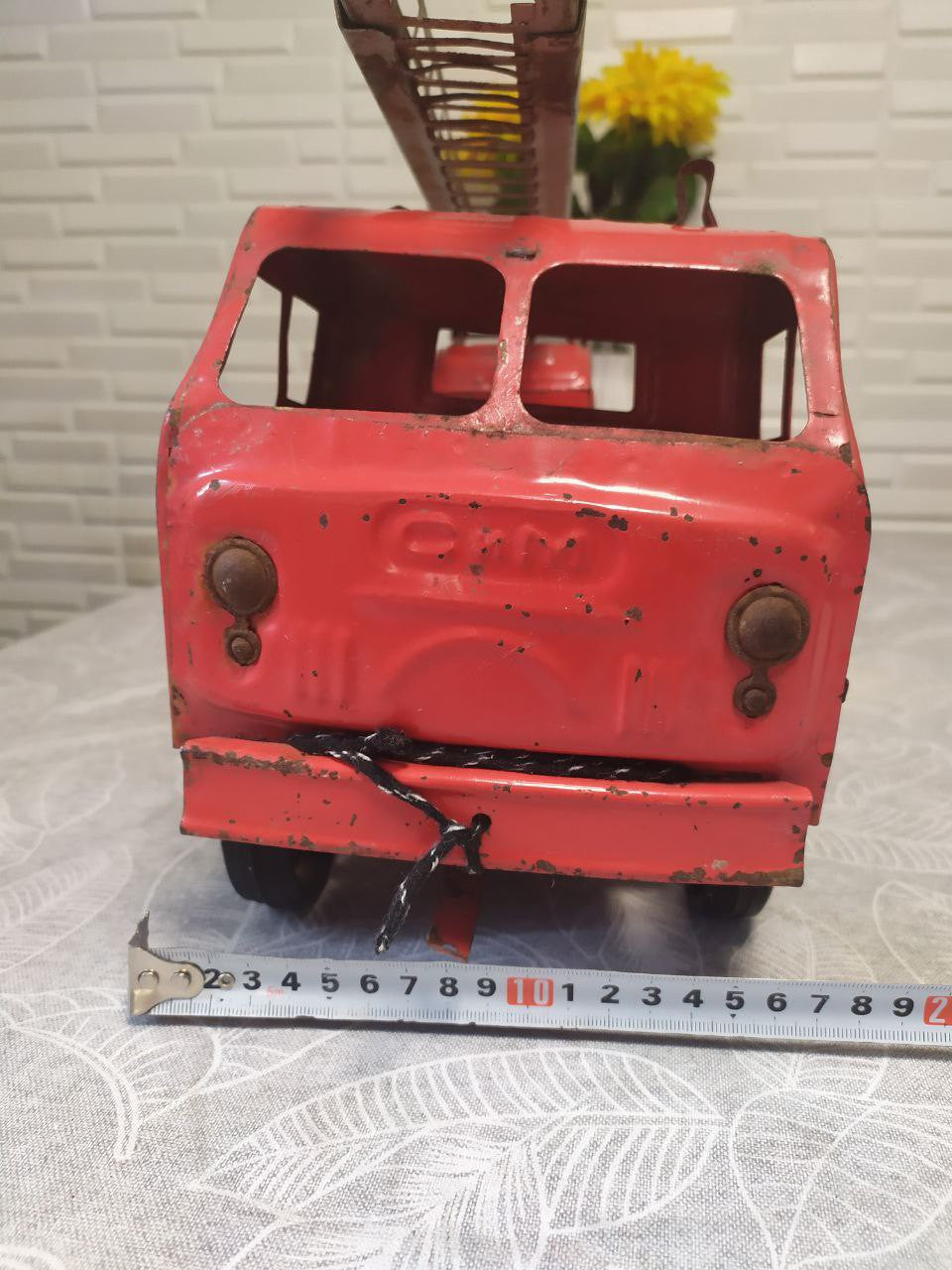 Embossed Soviet price stamp 19-82 on the rear of the toy truck – detail 12