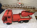 SIM Serp i Molot logo on the front of the Soviet toy fire truck